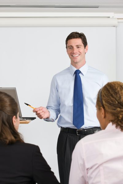 A lecturer teaching business students A lecturer teaching business students